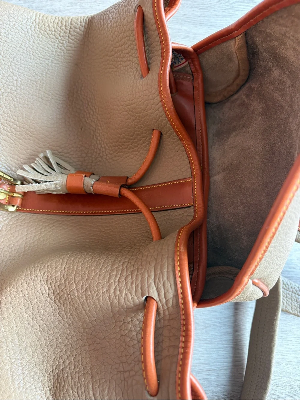 Dooney & Bourke Beige Leather Drawstring Backpack with Tan Trim